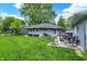 Well-maintained backyard with a patio set, lush lawn, and serene greenery, perfect for outdoor enjoyment at 169 Bayview Dr, Cicero, IN 46034
