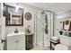 This well-lit bathroom offers a stand-up shower, modern sink, and decorative touches throughout at 169 Bayview Dr, Cicero, IN 46034