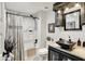Bathroom with a shower-tub, a unique stone sink, vanity, a framed mirror and wall art at 169 Bayview Dr, Cicero, IN 46034