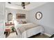 Neutral bedroom featuring a bed with throw pillows and blanket, a lamp, dresser, and mirror at 169 Bayview Dr, Cicero, IN 46034