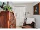 Bedroom featuring a dresser, chair and lamp, framed art, and white bi-fold doors at 169 Bayview Dr, Cicero, IN 46034
