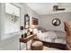 Bedroom with a window, dresser, throw pillows and blanket, ceiling fan, framed art and a mirror at 169 Bayview Dr, Cicero, IN 46034