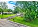 Charming home with well-kept lawn, a long driveway, and mature trees, offering great curb appeal at 169 Bayview Dr, Cicero, IN 46034