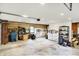 A spacious garage with room for storage, organized with racks and shelving along the wood paneled walls at 169 Bayview Dr, Cicero, IN 46034