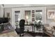 Comfortable home office featuring natural light, hardwood floors, and a cozy seating area at 169 Bayview Dr, Cicero, IN 46034