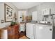Functional laundry room with modern washer and dryer, storage cabinets, and stylish decor at 169 Bayview Dr, Cicero, IN 46034