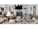 Inviting living room featuring a stone fireplace and comfortable seating, creating a warm ambiance at 169 Bayview Dr, Cicero, IN 46034
