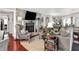 Cozy living room with a stone fireplace and plush seating, perfect for relaxing and entertaining at 169 Bayview Dr, Cicero, IN 46034