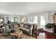 Bright living room with large windows, a comfortable seating arrangement and elegant decor at 169 Bayview Dr, Cicero, IN 46034