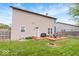 Backyard features a spacious deck with seating and a grill, with a well-manicured lawn at 1815 Kingen Dr, Greenfield, IN 46140