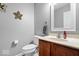 Cozy half bathroom featuring a single sink vanity with wood cabinets and a modern design at 1815 Kingen Dr, Greenfield, IN 46140