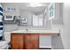 Bathroom features a single sink vanity with wood cabinets, a large mirror, decorative art and soft gray paint at 1815 Kingen Dr, Greenfield, IN 46140