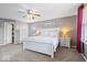 Bright bedroom features a ceiling fan, large windows, and neutral decor with a white furniture set at 1815 Kingen Dr, Greenfield, IN 46140