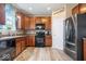 Kitchen featuring wood cabinets, modern appliances, and a double door refrigerator at 1815 Kingen Dr, Greenfield, IN 46140
