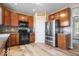 Kitchen featuring wood cabinets, modern appliances, and a stainless steel refrigerator at 1815 Kingen Dr, Greenfield, IN 46140