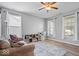 Cozy living area featuring wood floors, large bright windows, and comfortable furnishings at 1815 Kingen Dr, Greenfield, IN 46140