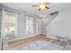 Entryway features a wood-look floor, a large window, a welcome mat, and neutral decor at 1815 Kingen Dr, Greenfield, IN 46140