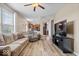 Open-concept living room with wood floors seamlessly flowing into the kitchen at 1815 Kingen Dr, Greenfield, IN 46140