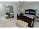 Cozy bedroom featuring a dark wood bed frame, patterned bedding, and mirrored closet doors at 199 Three Notch Ln, Bargersville, IN 46106