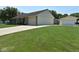 Ranch-style home with a brick facade, attached garage, large green lawn and mature shade trees at 199 Three Notch Ln, Bargersville, IN 46106