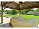 Gazebo and patio furniture covered in the backyard at 199 Three Notch Ln, Bargersville, IN 46106
