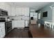 Bright kitchen featuring white cabinets, stainless steel appliances, and modern finishes at 199 Three Notch Ln, Bargersville, IN 46106
