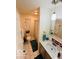 Bright bathroom features tiled floor, modern vanity, and shower with neutral walls at 209 Brighton Ct, Greenwood, IN 46143