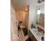 Well lit bathroom with a neutral vanity, tile floor, and shower at 209 Brighton Ct, Greenwood, IN 46143