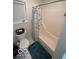 Clean bathroom featuring a shower and tub, white fixtures and a window at 209 Brighton Ct, Greenwood, IN 46143