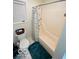 Well-lit bathroom with a tiled floor and shower with white walls, offering a clean and functional space at 209 Brighton Ct, Greenwood, IN 46143