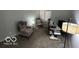 Bedroom with a window, carpet, rocking chair, and desk setup at 209 Brighton Ct, Greenwood, IN 46143