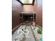 Private front courtyard with decorative gravel, stone pavers, and a covered porch at 209 Brighton Ct, Greenwood, IN 46143