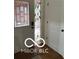 Entryway with decorative stained glass sidelight window and hardwood flooring at 209 Brighton Ct, Greenwood, IN 46143