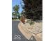 A winding road and rock garden draw the eye to the home at 209 Brighton Ct, Greenwood, IN 46143