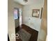 A bright foyer featuring hardwood floors and a decorative stained glass window at 209 Brighton Ct, Greenwood, IN 46143