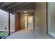 Inviting front porch features a stained glass sidelight and decorative planter at 209 Brighton Ct, Greenwood, IN 46143