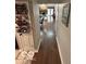 Hallway view showcasing hardwood floors, neutral walls and view of the living room at 209 Brighton Ct, Greenwood, IN 46143