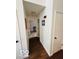 Hallway features hardwood flooring, neutral paint, and access to other rooms in the home at 209 Brighton Ct, Greenwood, IN 46143