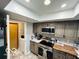 A well-lit kitchen featuring stainless steel appliances and hardwood countertops at 209 Brighton Ct, Greenwood, IN 46143