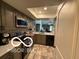 Well-lit kitchen showcasing modern appliances and a seamless flow to the living area at 209 Brighton Ct, Greenwood, IN 46143