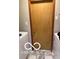 Small laundry room with a wood door, light gray walls, tiled floor, and standard washer and dryer hookups at 209 Brighton Ct, Greenwood, IN 46143