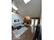 Bright living room with a fireplace, skylights and hardwood floors at 209 Brighton Ct, Greenwood, IN 46143