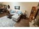Comfortable living room with gray sofa, wood floors, and natural light at 209 Brighton Ct, Greenwood, IN 46143