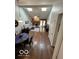 Open-concept layout, vaulted ceilings, skylights, and view of the fireplace creates a welcoming living space at 209 Brighton Ct, Greenwood, IN 46143