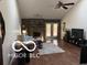 Bright living room with a vaulted ceiling, hardwood floors, and a cozy fireplace at 209 Brighton Ct, Greenwood, IN 46143