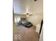 This spacious bedroom has neutral carpeting, a ceiling fan, and a sitting bench at 209 Brighton Ct, Greenwood, IN 46143