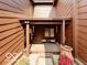 Cozy, covered patio with comfortable seating and a decorative flower pot for relaxing or entertaining at 209 Brighton Ct, Greenwood, IN 46143