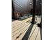A tranquil wooden deck offers a serene outdoor space with garden views at 209 Brighton Ct, Greenwood, IN 46143