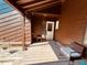 Inviting covered porch with seating and a hanging plant, creating a warm and welcoming entrance at 209 Brighton Ct, Greenwood, IN 46143