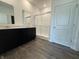 Bathroom featuring double vanity, quartz countertop, and walk-in shower with glass door at 2143 Warbler St, Danville, IN 46122